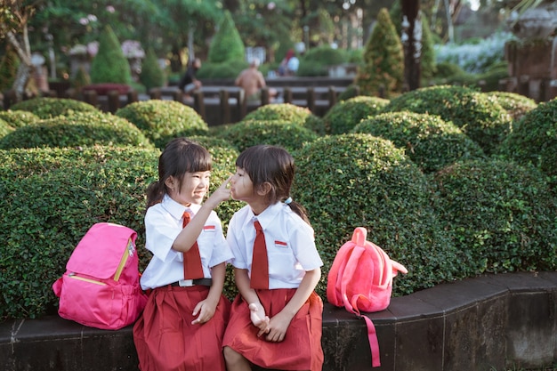 Happy student friend in uniform smiling