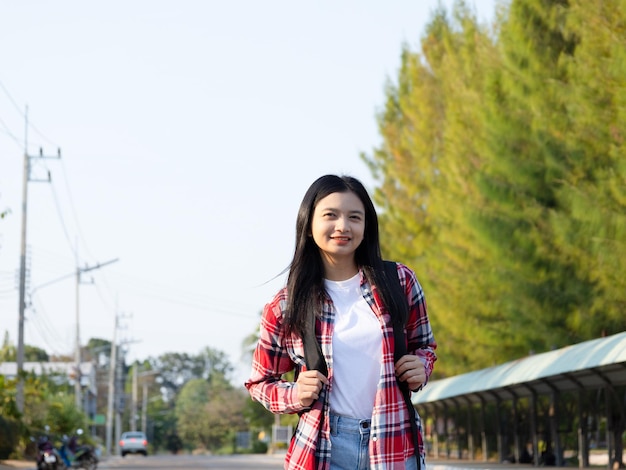 hAPPY STUDENT YOUNG GIRL WALKING AT SCHOOL WITH BACKPACK