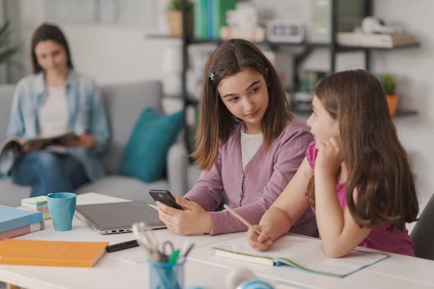 Happy students doing homework together