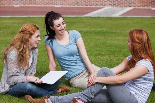 Happy students sitting together