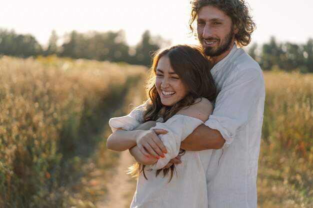 Happy summer. A loving couple together in nature. Happy vacation. Family recreation. Enjoyment and relaxation. Being happy together.