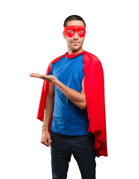 Happy superhero with show gesture