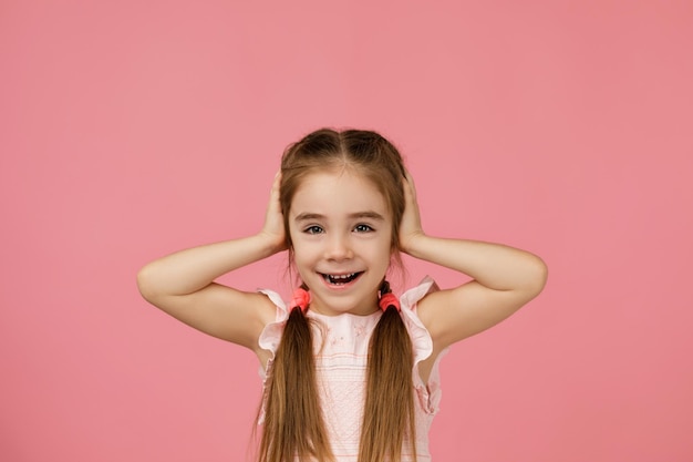 Happy surprised beautiful little child girl in dress