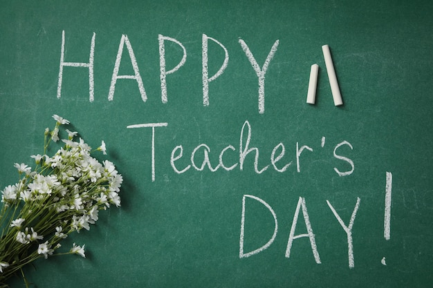 happy teacher's day greetings inscription on a green board