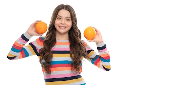 Happy teen girl in colorful sweater with orange fruit isolated on white vitamins Child girl portrait with orange horizontal poster Banner header with copy space