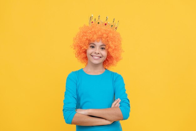 Happy teen girl in fancy clown wig wear queen crown ego