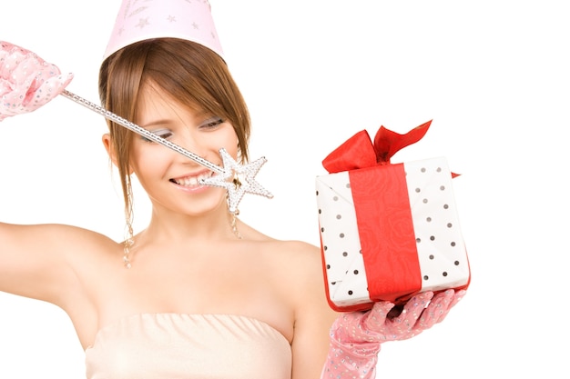 happy teenage party girl with magic wand and gift box