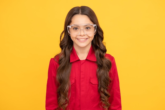 Happy teenager girl improve eyesight in protective glasses oculist