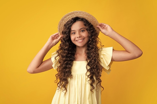 Happy teenager positive and smiling emotions of teen girl headshot portrait of teenager child girl isolated on studio background childhood lifestyle concept mock up copy space