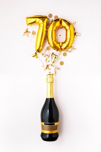 Happy th anniversary party champagne bottle with gold number balloon