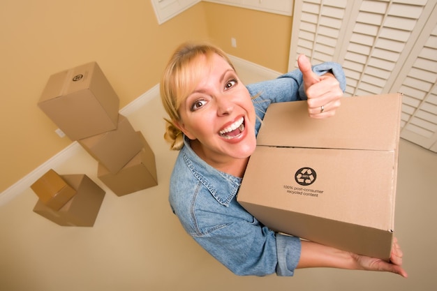 Happy Thumbs Up Woman Moving Boxes