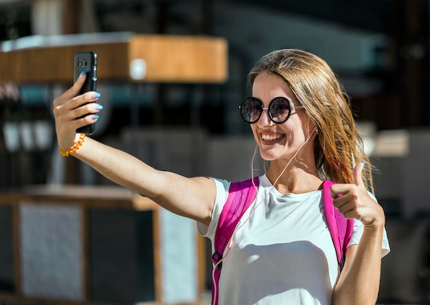 Happy Tourist Girl Taking Selfie