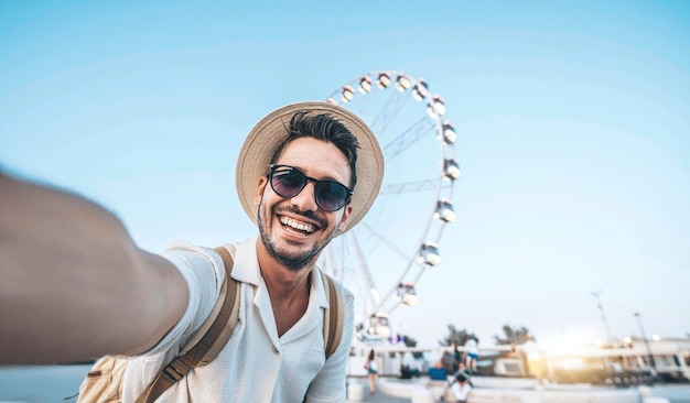 Happy tourist taking selfie on summer vacation