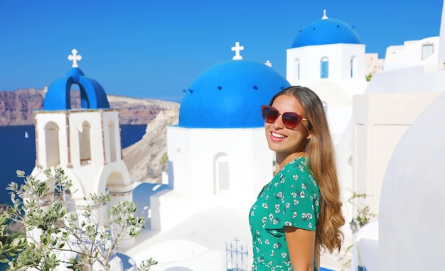 Happy tourist woman enjoying travel in Greece