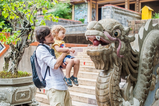 Happy tourists dad and son in LongSon Pagoda