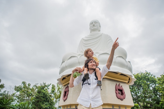 Happy tourists dad and son in LongSon Pagoda