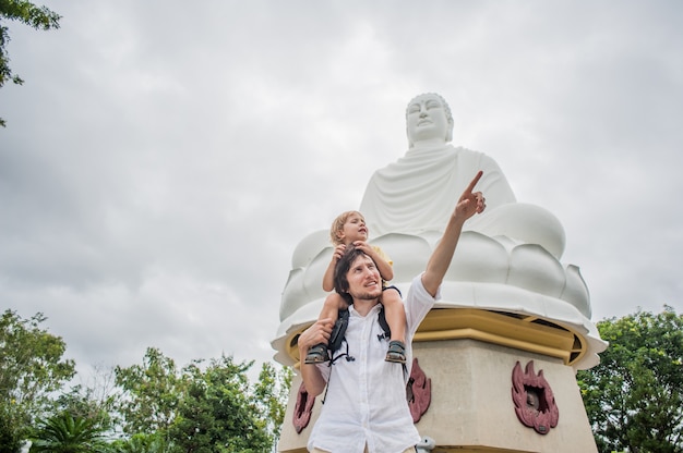 Happy tourists dad and son in LongSon Pagoda