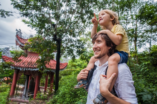 Happy tourists dad and son in LongSon Pagoda