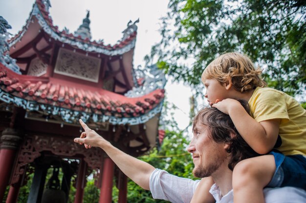 Happy tourists dad and son in LongSon Pagoda