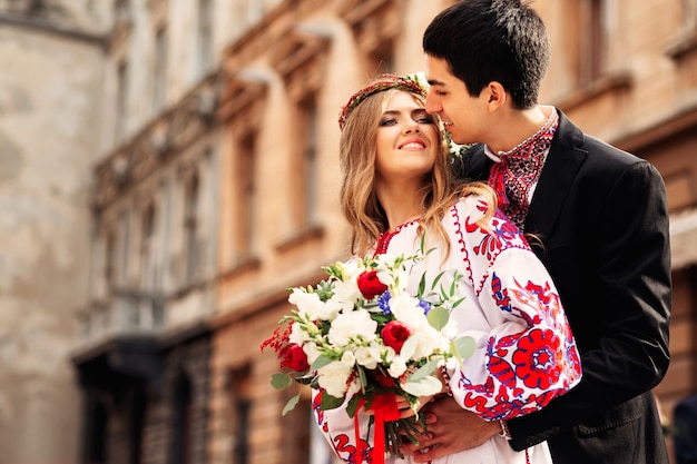 Happy Ukrainian couple wearing traditional clothes