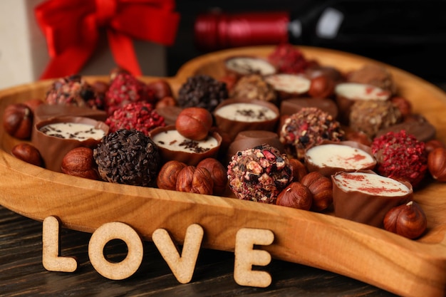 Happy Valentine day composition on wooden background, close up