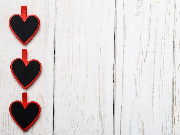 Happy Valentine's day hearts on wooden table. Valentine card