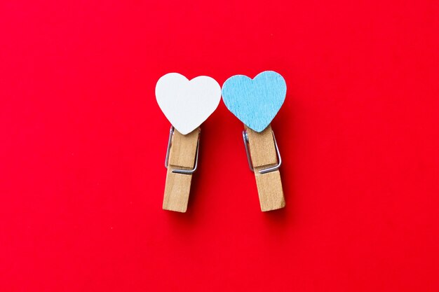 Happy valentines day 2021. Two clothespin with hearts. Postcard