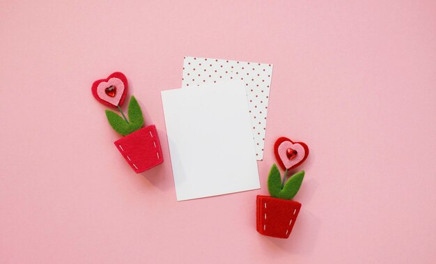 Photo happy valentines day composition. blank greeting card mockup on pink background