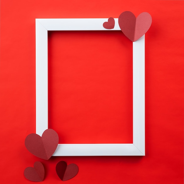 Happy Valentines Day with paper red heart and white horizontal frame