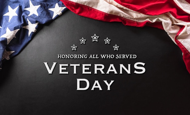 Happy veterans day concept made from american flag and the text
on dark wooden background