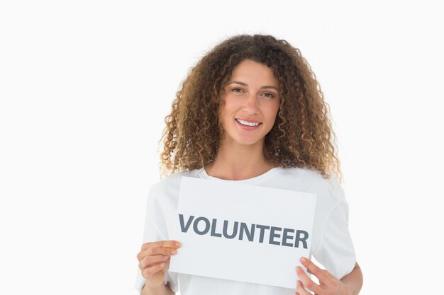 Photo happy volunteer showing a poster