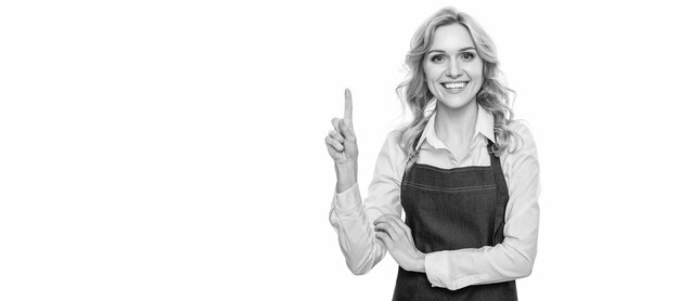 Happy waiter woman in apron point finger isolated on white background Woman isolated face portrait banner with mock up copy space