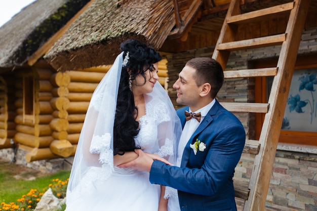 Happy wedding couple walking in the park