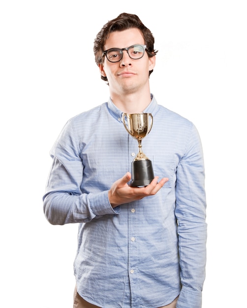 Photo happy winner guy holding a gold cup