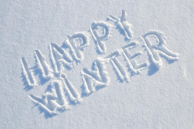 Photo happy winter written on snow