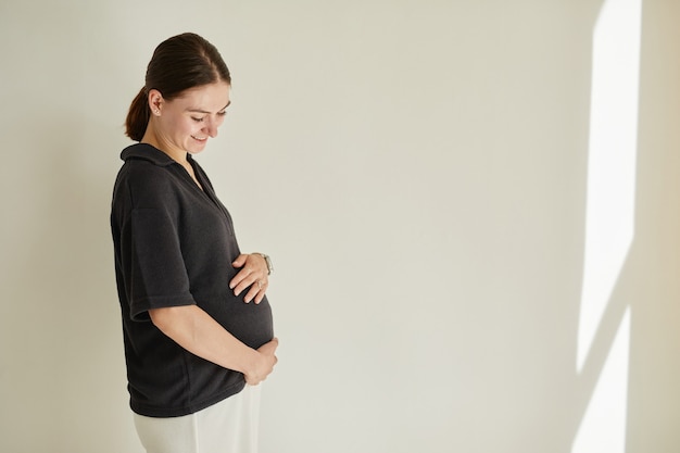 Happy Woman In Anticipation Of Baby