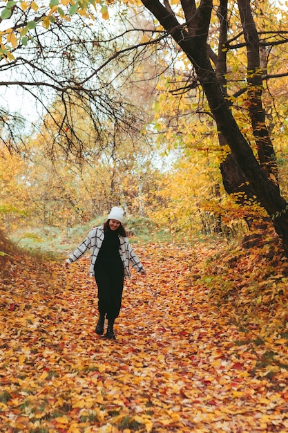 Happy woman autumn city park town on background copy space