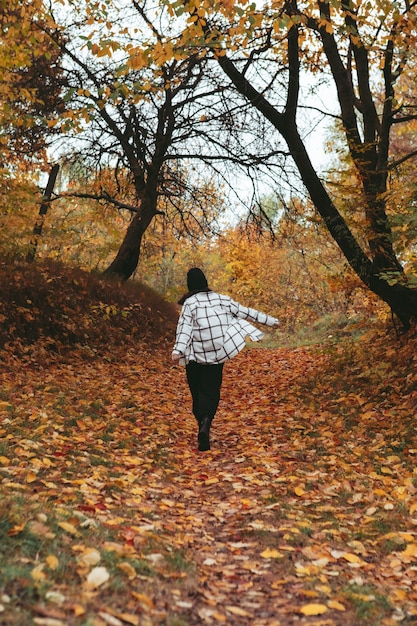 Happy woman autumn city park town on background copy space