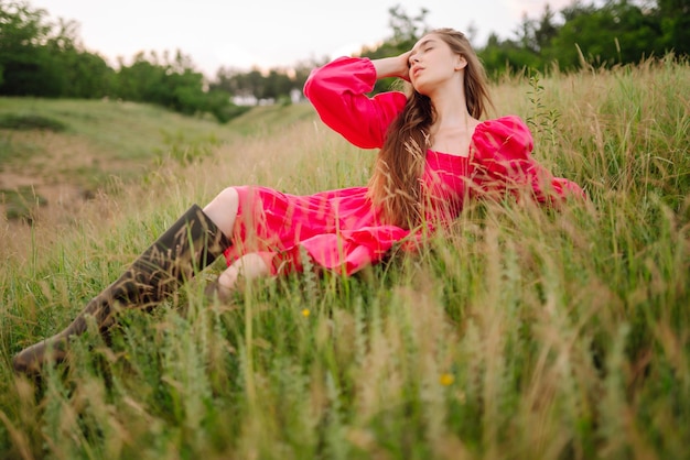 Happy woman in the blooming field Nature vacation relax and lifestyle Summer landscape