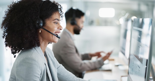 Happy woman call center and customer service in telemarketing support or communication at office Friendly female person consultant or agent smile in online advice help or contact us at workplace