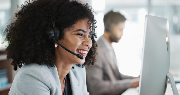 Photo happy woman call center and face with headphones in customer service support or telemarketing at office friendly person consultant or agent smile in online advice help or contact us at workplace