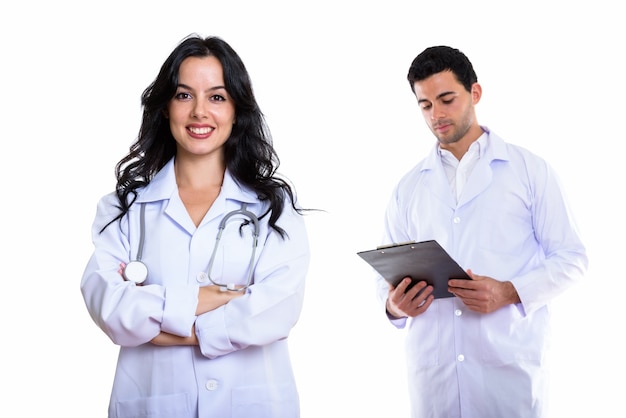 happy woman doctor smiling with arms crossed