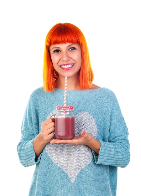 Happy woman drinking a pink detox juice 
