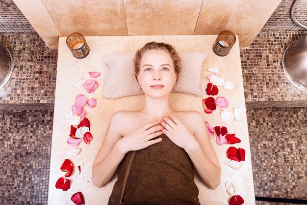 Happy woman in hammam or turkish bath in relax