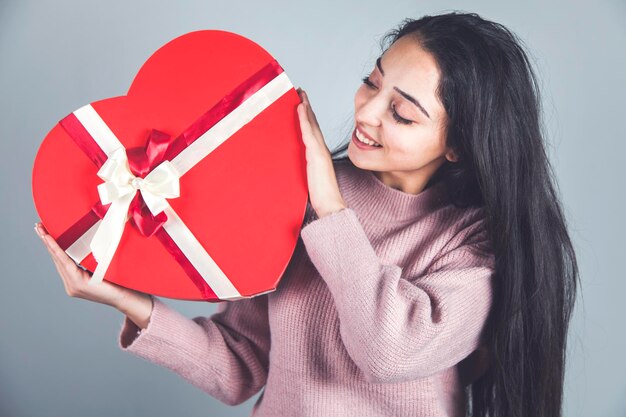 Happy woman hand big red heart