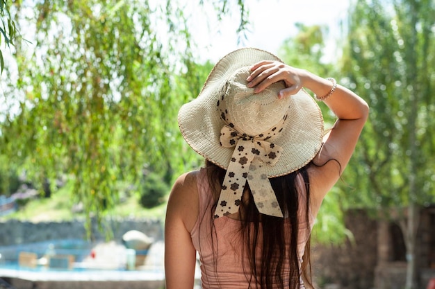 Happy woman hand in hat