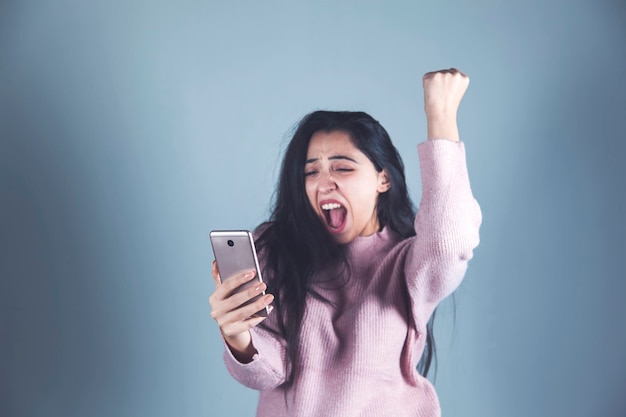 Happy woman hand holding phone