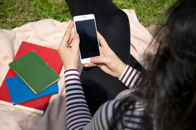 Happy woman hand smart phone in nature