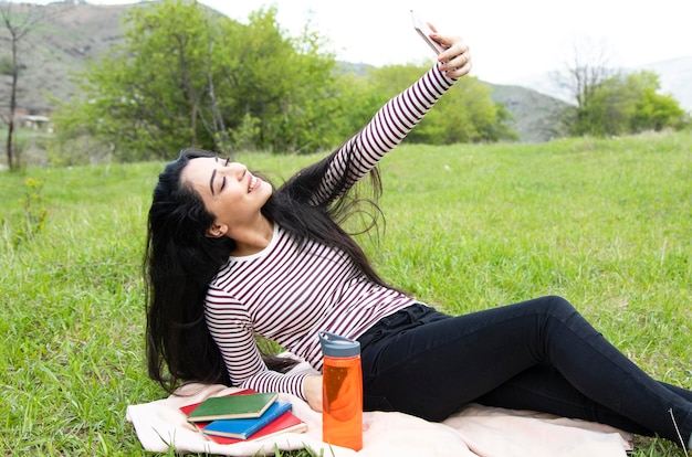 Happy woman hand smart phone selfie