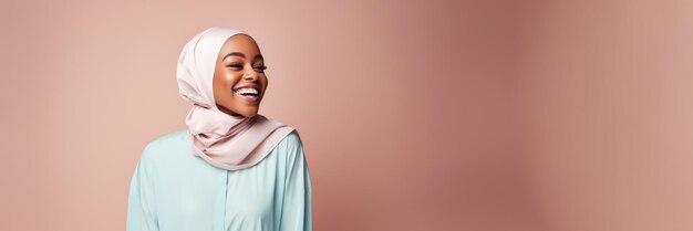 Photo happy woman in hijab with a laugh on colored background positivity and fashion concept generative ai